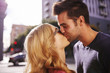 © Joshua Resnick - couple kissing on street in downtown los angeles close up