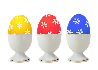 Wall Mural - Colorful Easter Eggs in stand isolated on white