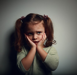 Wall Mural - Abandoned scared kid with hands near face looking with horror