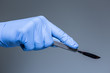 Close-up of scalpel in the hand of doctor