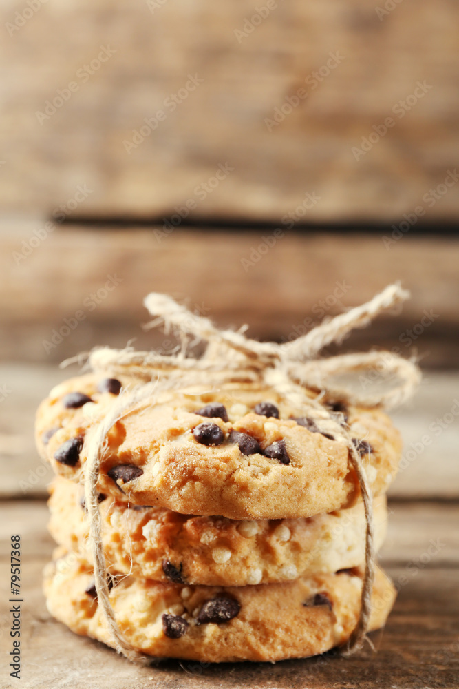 Tasty cookies on rustic wooden background