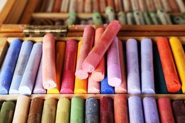 colorful chalk pastels in box close up