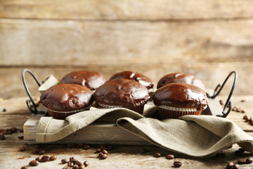 Canvas Print - Tasty homemade chocolate muffins on wooden table