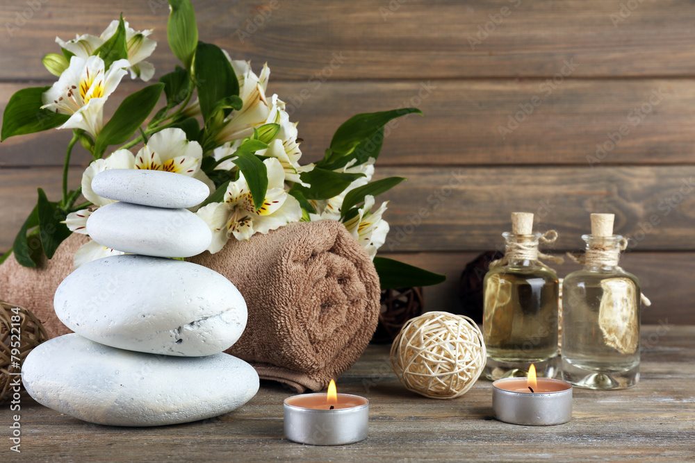 Beautiful spa composition with stones and flowers