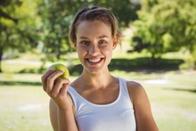 Fit Woman Holding Green Apple