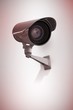 © WavebreakMediaMicro - Burglar hacking into laptop while looking at camera
