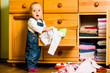 © Martinan - Domestic chores - baby throws out clothes