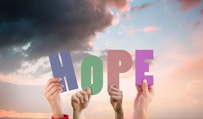 Poster - Composite image of hands holding up hope
