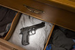 hand gun in drawer