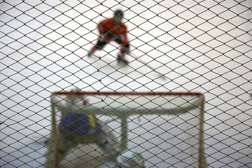 Wall Mural - Atack of gate and ice hockey goalkeeper