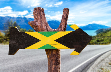 Wall Mural - Jamaica Flag sign with road background