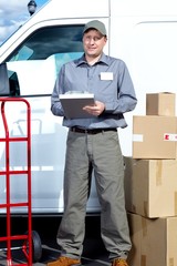 Wall Mural - Postman with parcel box.