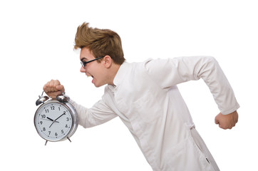 Wall Mural - Funny doctor with alarm clock isolated on white