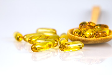 Wall Mural - Closeup yellow soft gelatin supplement fish oil capsule