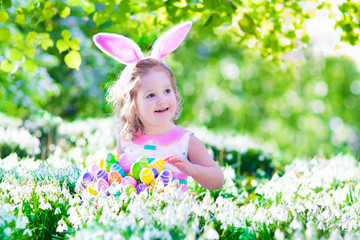 Wall Mural - Little girl at egg hunt