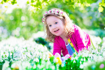 Wall Mural - Little girl at egg hunt