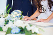 Bride signing wedding license