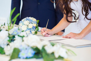 Bride signing wedding license