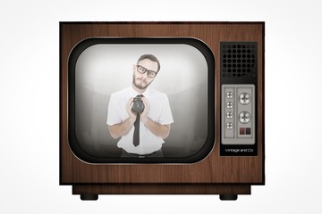 Poster - Composite image of geeky businessman holding alarm clock