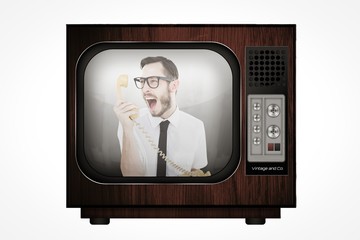 Aufkleber - Composite image of geeky businessman shouting at telephone