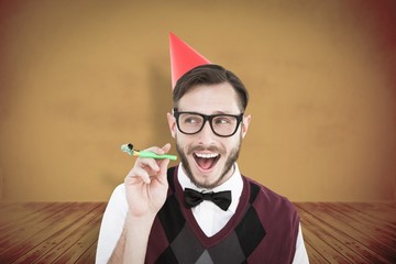 Poster - Composite image of geeky hipster in party hat with horn