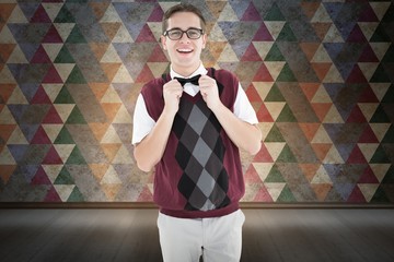 Poster - Composite image of geeky hipster fixing his bow tie