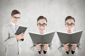 Poster - Composite image of nerd reading book