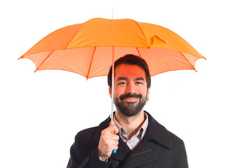 Man holding an umbrella over white background