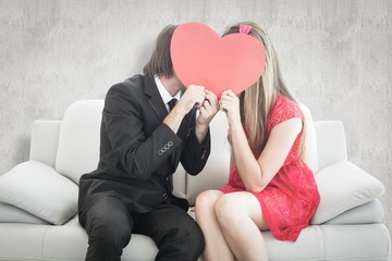 Poster - Cute geeky couple kissing and holding heart over faces