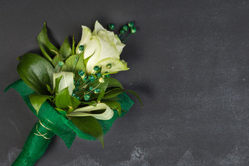 White rose on dark chalkboard with copy-space