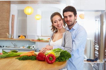 Young Сouple Сooking in The Kitchen. Healthy food