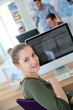 © goodluz - Portrait of student girl sitting in front of desktop