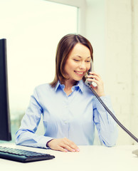 Canvas Print - businesswoman with laptop and telephone