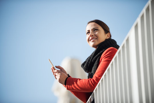 Smiling woman on a terrace