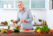 canvas print picture - Mature man in the kitchen prepare salad VI