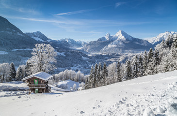 Wall Mural - Idyllic winter landscape in the Alps with mountain chalet