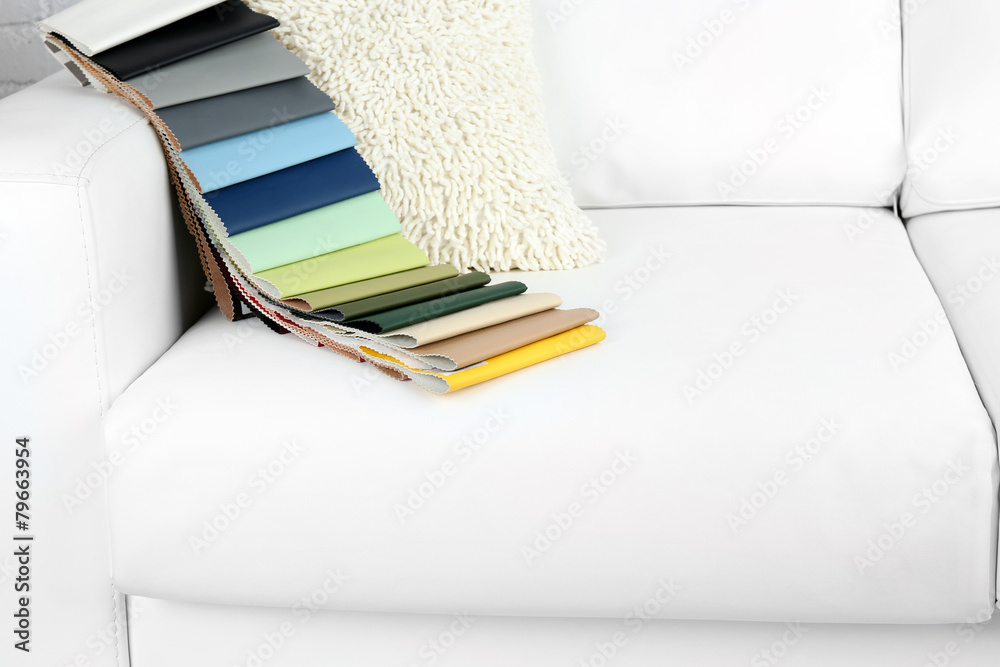 Scraps of colored tissue on sofa close up