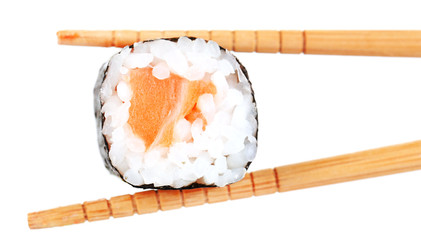 Sushi roll with chopsticks isolated on white