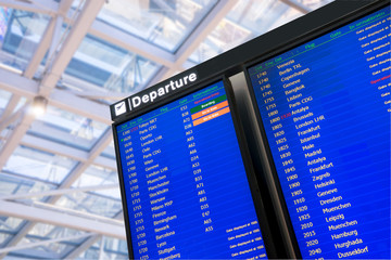 Wall Mural - Flight, arrival and departure  board at the airport,