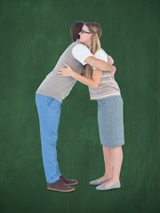 Poster - Composite image of geeky hipster couple hugging