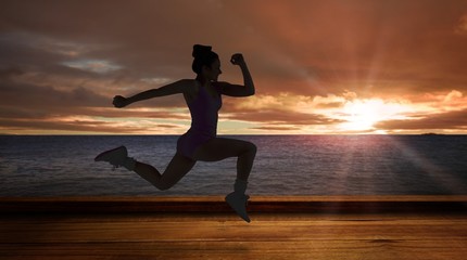 Aufkleber - Composite image of fit brunette running and jumping