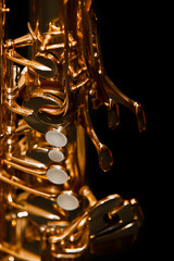 Poster - Fragment of a saxophone on a black background