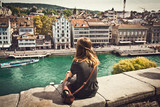 Fototapeta  - Female student looking at Zurich cityscape, Switzerland