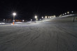 Night skiing in Levi, Finland. Groomed ski slopes illuminated at night
