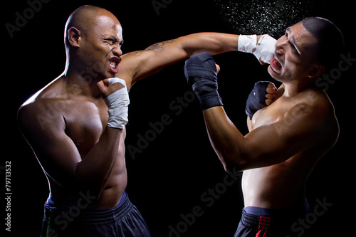 sparring mma fighters or boxers punching each other Fototapete