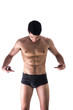 © theartofphoto - Young man in underwear pointing fingers at empty blank space for