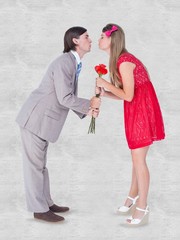 Poster - Composite image of cute geeky couple kissing