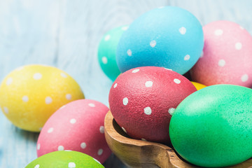  colored Easter eggs on wooden