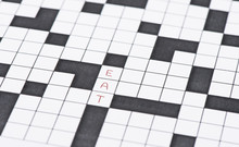 Closeup Of Crossword Puzzle And The Word Eat
