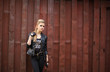 © kozirsky - teen girl rock outdoor near red wall